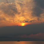 A tugboat on the water at sunset